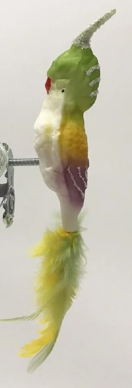 Cockatiel with feather tail, matte green, yellow and orchid by Glas Bartholmes